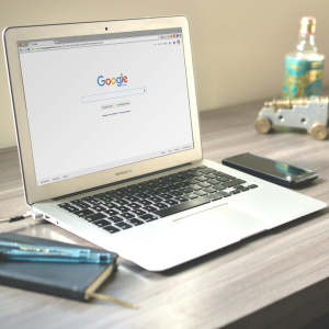 Macbook air on grey wooden table