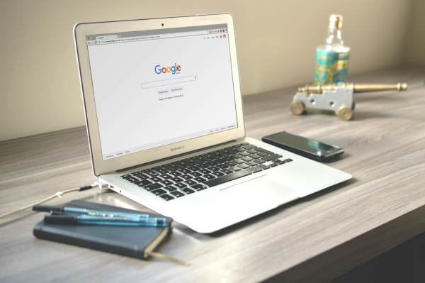 Macbook air on grey wooden table